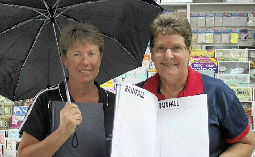 Hynes Newsagency’s Kerry Fearby and Regina Millard happily promote the rainfall record book they had printed for customers. Hynes Newsagency’s Kerry Fearby and Regina Millard happily promote the rainfall record book they had printed for customers.